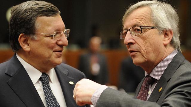 José Manuel Barroso cède la place à Jean-Claude Juncker. [AFP - John Thys]