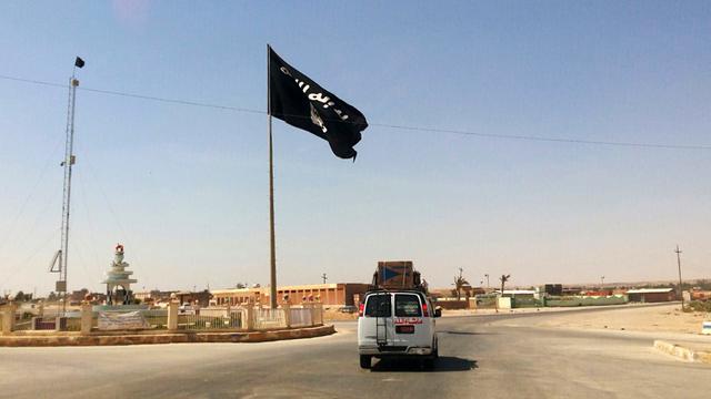 Le drapeau noir de l'Etat islamique flotte dans de nombreuses villes en Irak et en Syrie. [AP/Keystone]