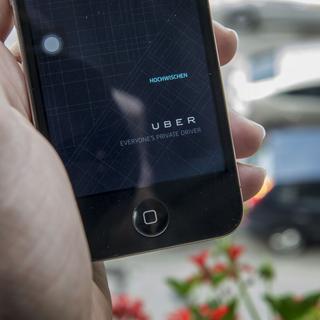 La société de voiturage Uber fait polémique à Genève et dans le monde. [Keystone - Christian Beutler]