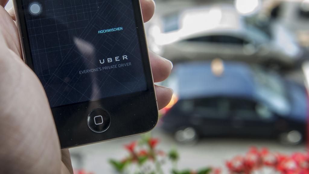 La société de voiturage Uber fait polémique à Genève et dans le monde. [Keystone - Christian Beutler]