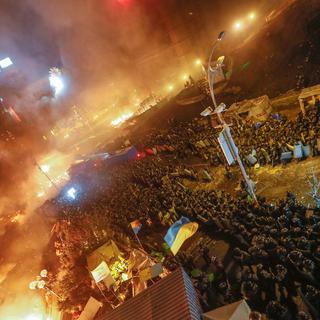 La place de l'Indépendance à Kiev est en feu depuis le début de l'assaut. [EPA/Keystone - Alexey Furman/Sergey Dolzhenko]