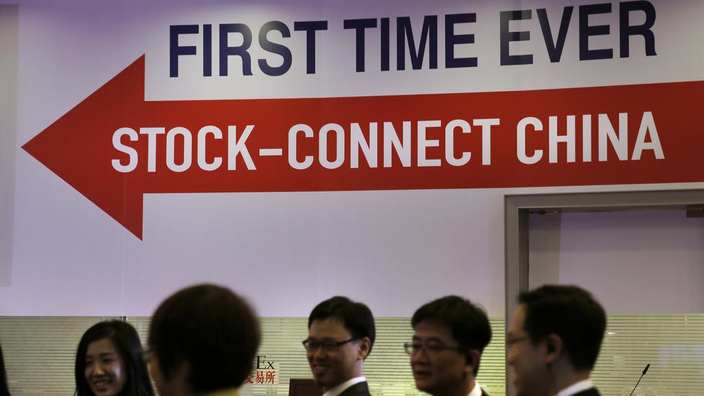 "Stock Connect" unit les Bourses de Hong Kong et de Shanghai pour donner naissance à l'une des plus grandes places financières au monde. [AP Photo/Vincent Yu]