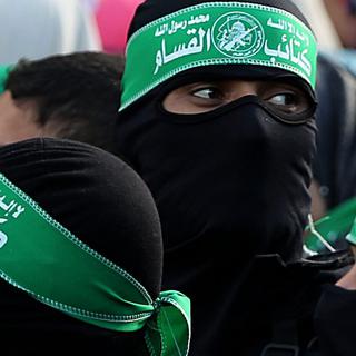 Des membres de la branche armée du Hamas. [Keystone - EPA/Mohammed Saber]
