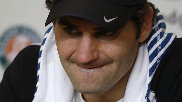 Le coeur n'y était pas pour Federer en conférence de presse d'après-match, dimanche. [AP/Keystone - Michel Euler]