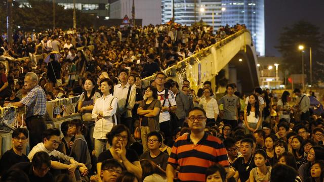 Retour des manifestants dans le centre-ville de Hong Kong, ce 10 octobre 2014. [AP Photo/Kin Cheung]