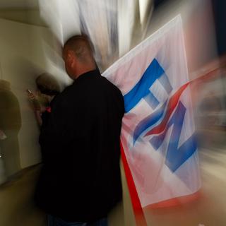 Un partisan du FN photographié lors d'un meeting du parti en mars dernier. [AP Photo/Claude Paris]