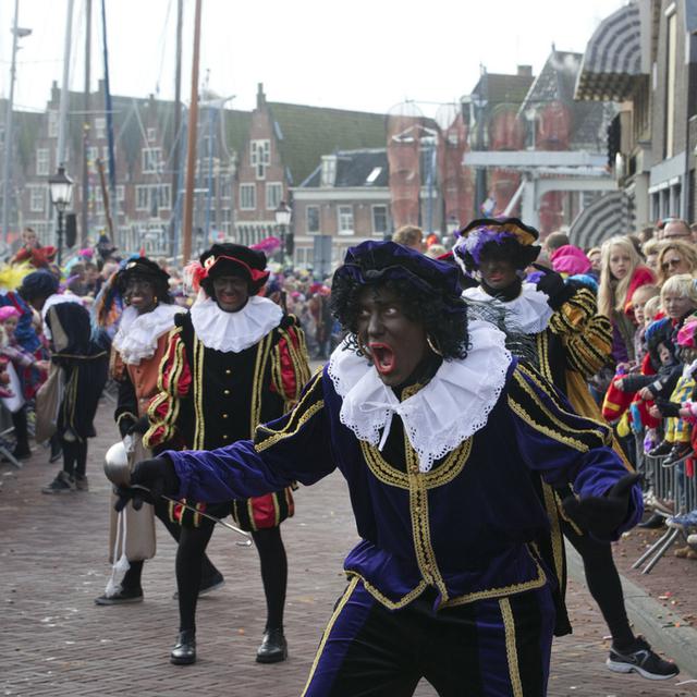 Le Père Fouettard - Zwarte Piet - lors du défilé à Amsterdam en 2013. [AP/Keystone - Peter Dejong]