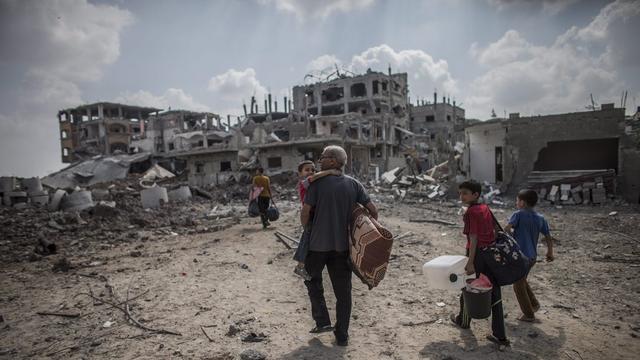 Les habitants de la bande de Gaza retrouvent des lieux sinistrés. [EPA/Olivier Weiken]