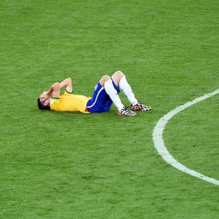 Oscar est en larmes et tout le Brésil avec lui au lendemain de l'humiliation vécue face à l'Allemagne. [Keystone - Andreas Gebert]