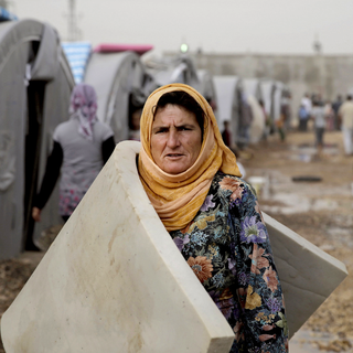 Femme kurde dans un camp de réfugiés kurdes ayant fui Kobané en Syrie. [AP/Keystone - Lefteris Pitarakis]