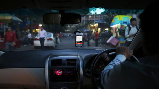 La société américaine Uber cherche à se développer dans les grandes villes indiennes. [Keystone - AP Photo/Saurabh Das]