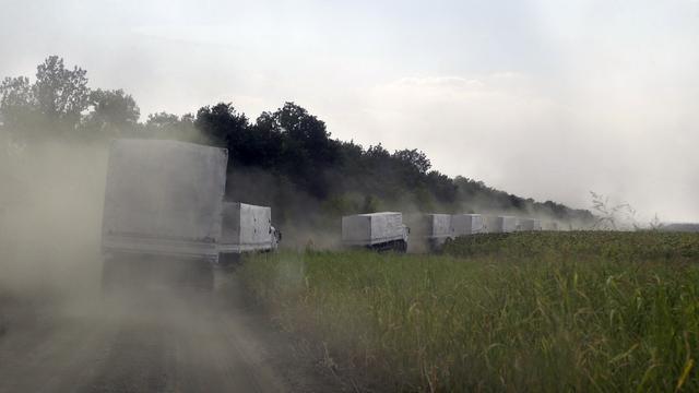 Les premiers camions d'aide humanitaire russe sont déjà de retour en Russie. [AP Photo/Keystone - Sergei Grits]