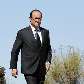 Courtes vacances et rentrée chaude pour François Hollande. [EPA/Sébastien Nogier]