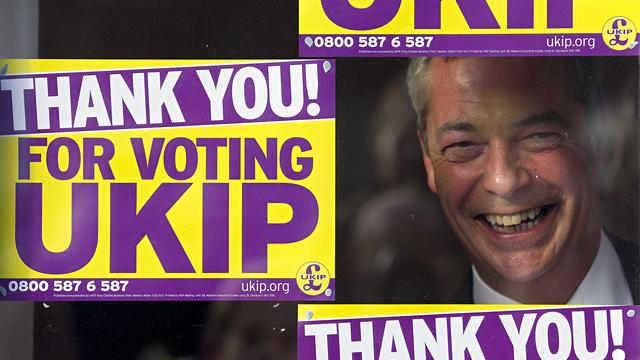 Nigel Farage photographié le 10 octobre dernier, à travers la vitre des bureaux de Ukip. [Justin Tallis]