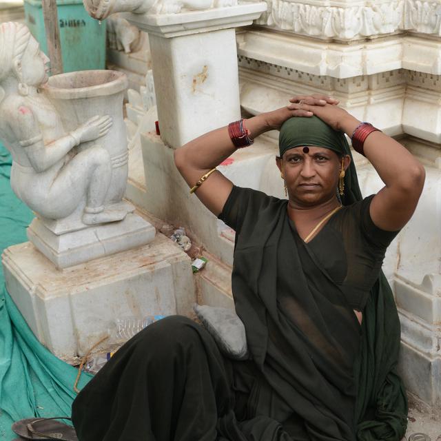 INDIA, Becharaji : An Indian transgender sits in the campus of Becharaji Temple some 110 kms from Ahmedabad where transgenders and eunuchs or hijras gather to worship Goddess Becharaji on April 15, 2014. India's highest court ruled Tuesday that a person can be legally recognised as gender-neutral, a landmark judgement that raises hopes of an end to discrimination against several million transgenders and eunuchs. AFP PHOTO / Sam PANTHAKY [Sam Panthaky]