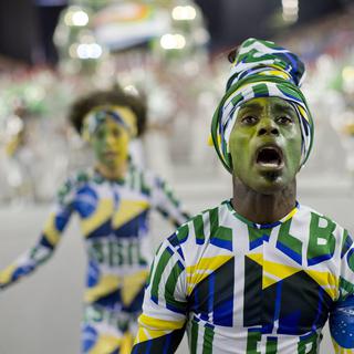 Des membres d'une école de samba le jour du lancement du Carnaval de Rio, en février 2014. [Sebastiao Moreira]