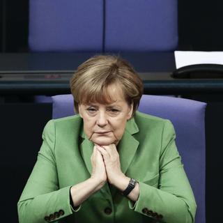 La chancelière allemande Angela Merkel était au départ plutôt opposée à l'idée des quotas proposée par ses partenaires les sociaux-démocrates. [AP Photo/Markus Schreiber]