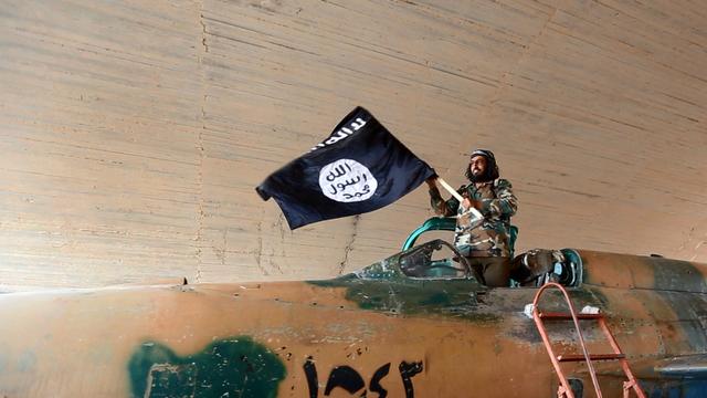 Les djihadistes de l'Etat islamique ont annoncé la décapitation d'un troisième otage. [AP Photo/Raqqa Media Center of the Islamic State group/Keystone]