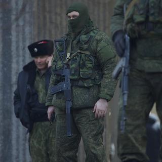 Les militaires sans insignes en Crimée pourraient être des soldats Russes. [AP/Keystone - Ivan Sekretarev]