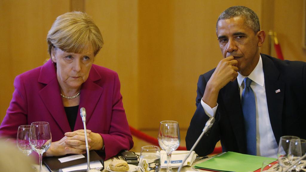 Angela Merkel et Barack Obama. [AP Photo/Charles Dharapak]