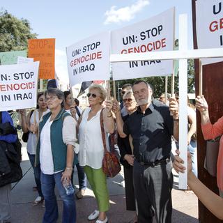 Des protestataires lors d'une manifestation de soutien aux minorités chrétiennes et yazidis en Irak, le 19 août à Genève. [Salvatore Di Nolfi]
