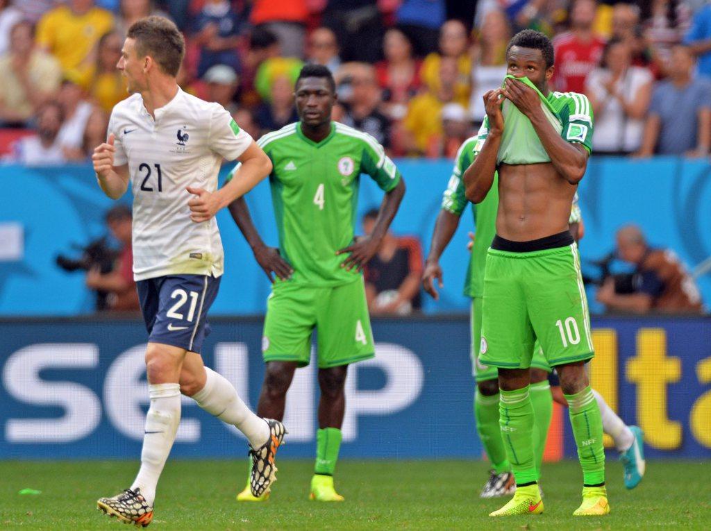 John Obi Mikel et les Super Eagles ont longtemps tenu la dragée haute aux Bleus. [KEYSTONE - PETER POWELL]