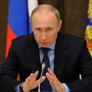 Le président russe Vladimir Poutine lors d'une conférence le 12 mars. [Keystone - Mikhail Klimentyev]