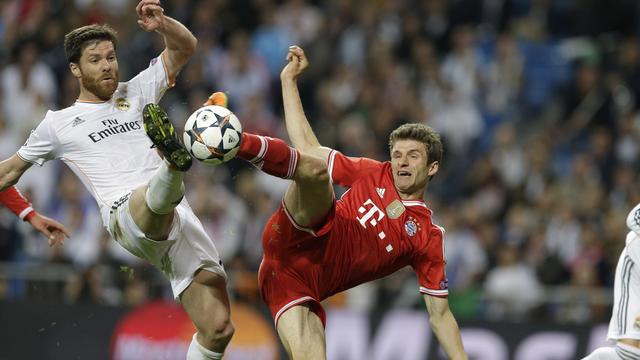 Thomas Müller (à dr.) et le Bayern arriveront-ils à renverser la vapeur face au Real de Xabi Alonso? [Paul White]