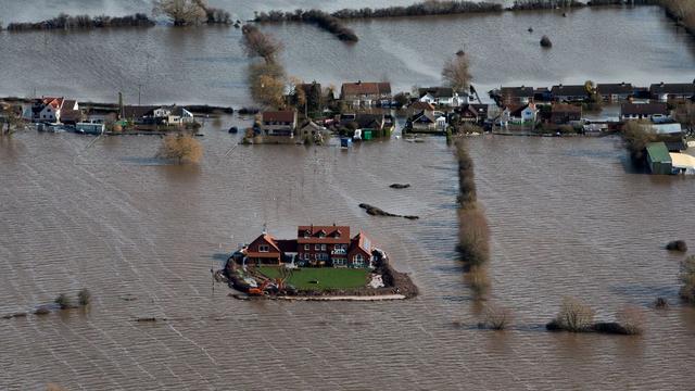 Les inondations dans le village de Moorland, dans le comté de Somerset. [AP Photo/Steve Parsons]