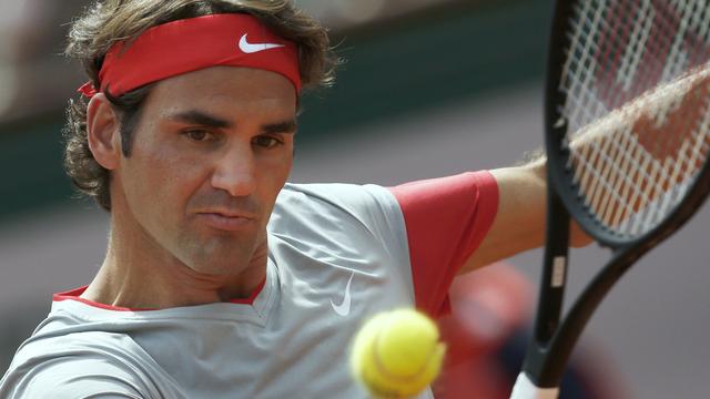 Roger Federer joue pour la 16e fois à la Porte d'Auteuil face au Slovaque Lukas Lacko. [AP/Keystone - Darko Vojinovic]