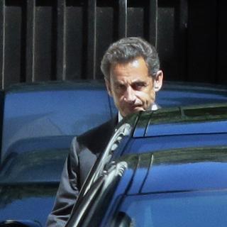 Nicolas Sarkozy quittant son domicile mercredi. [Jacques Demarthon]