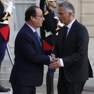 François Hollande et Didier Burkhalter. [EPA/Ian Langsdon]