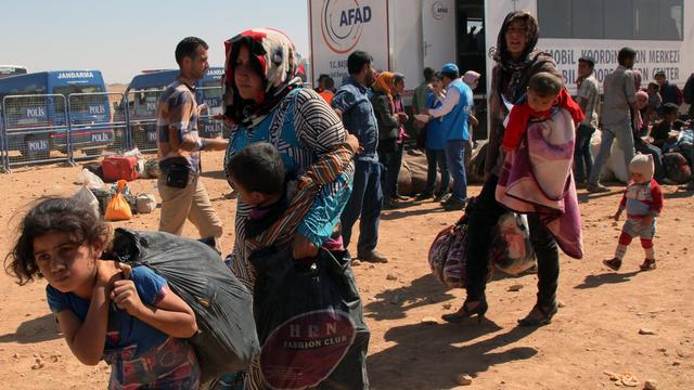 Des dizaines de milliers de Kurdes syriens sont venus se réfugier en Turquie. [Burhan Ozbilici - AP Photo]