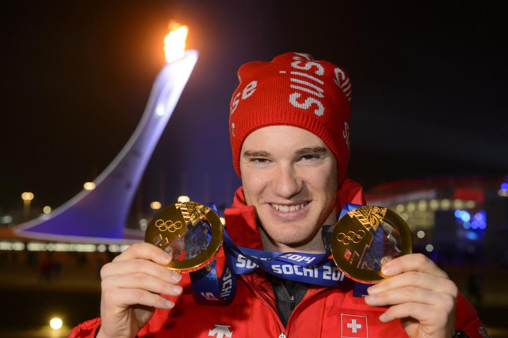 Dario Cologna pourrait ajouter une 3e médaille autour de son cou dimanche. [KEYSTONE - Laurent Gillieron]