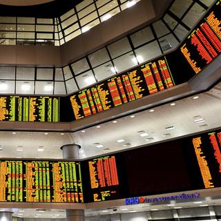 Les marchés financiers seraient à l'aube d'une nouvelle crise, selon les experts. [AP Photo/Keystone - Joshua Paul]