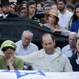 Les obsèques de trois Israéliens le 1er juillet dernier. [AP Photo/Tomer Appelbaum]