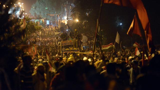 Les manifestants qui soutiennent Tahir-ul-Qadri marchent sur le Parlement pakistanais, le 19 août 2014. [Farooq Naeem]