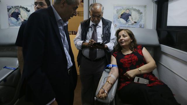 Don du sang à Amman en faveur des Palestiniens blessé dans le conflit avec Israël. [Anadolu Agency/AFP - Salah Malkawi]