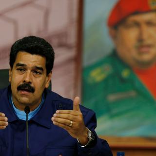Troublé par une vague de protestation contre le gouvernement de Nicolas Maduro, le Venezuela commémore le décès de Hugo Chavez. [AP/Keystone - Fernando Llano]