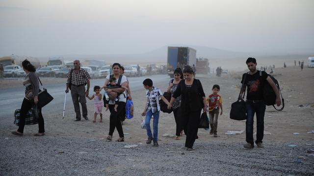 De nombreux chrétiens fuient le nord de l'Irak face à la progression des djihadistes. [AFP - Mustafa Kerim]