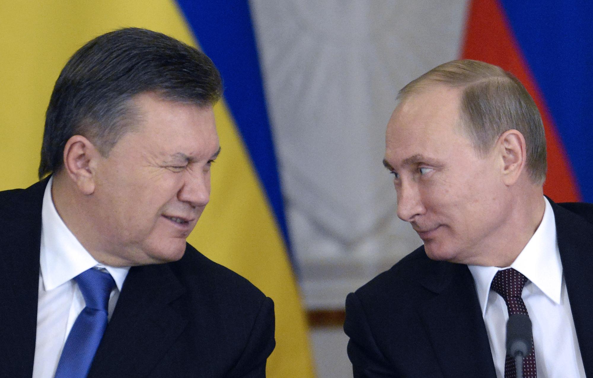 Le président ukrainien déchu Viktor Ianoukovitch et le chef du Kremlin Vladimir Poutine. [AFP - Alexander Nemenov]