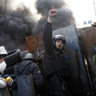 Les affrontements entre police et manifestants se poursuivent dans le centre de Kiev, entre la place de l'Indépendance et le parlement. [AP/Keystone - Marko Drobnjakovic]