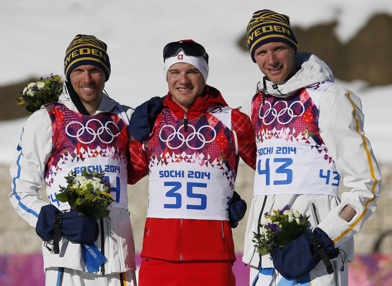 Cologna n'a laissé que des miettes aux Suédois Olsson (à g.) et Richardsson. [REUTERS - Stefan Wermuth]