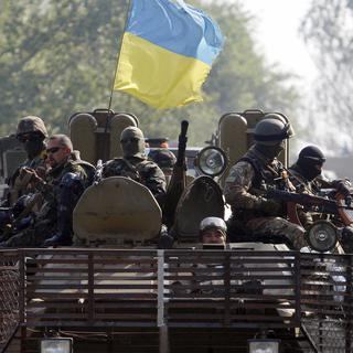 Des militaires ukrainiens lors d'une patrouille dans la région de Donetsk le 15 septembre, 2014. [ANATOLII STEPANOV]