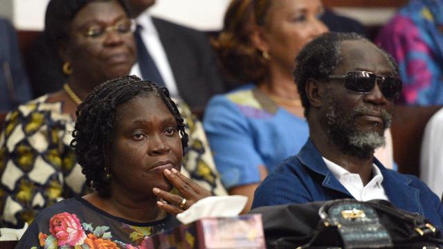 Simone Gbagbo et l'ancien Premier ministre ivoirien Gilbert Ake N'Gbo devant la Cour de justice à Abidjan, le 26 décembre 2014. [AFP - Sia Kambou]