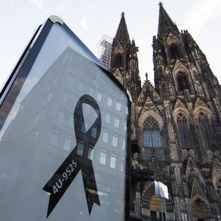 Hommage national à Cologne aux victimes du crash de l'avion de Germanwings. [key - EPA/Rolf Vennenbernd]