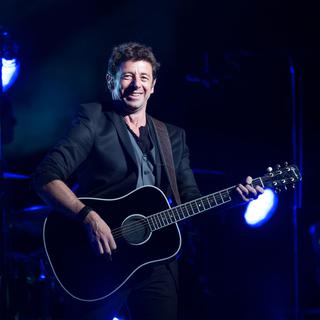 Patrick Bruel en concert à New York en 2014. [Getty Images/AFP - Dave Kotinsky]