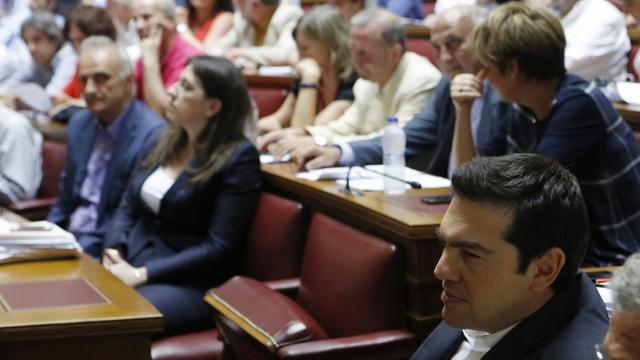 Le débat a débuté au Parlement grec, en précense du Premier ministre Alexis Tsipras. [AP Photo/Petros Karadjias]