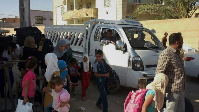 Des civils fuyant la ville de Ramadi le 18 mai. [AP Photo/Keystone - Non crédité]