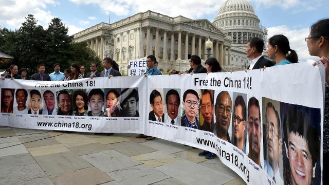 Des proches de prisonniers politiques chinois manifestent pour leur libération à Washington, en septembre 2014. [Mladen Antonov]